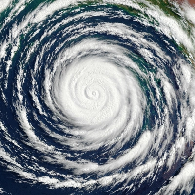 Satellite view of a tropical cyclone forming over warm ocean waters